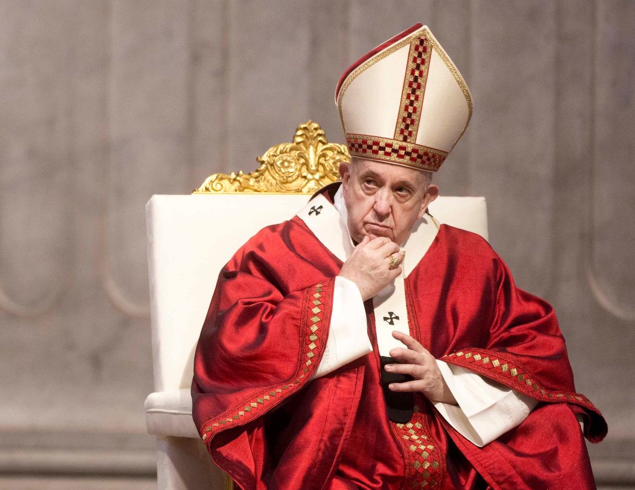 pop francis in red outfit thinking