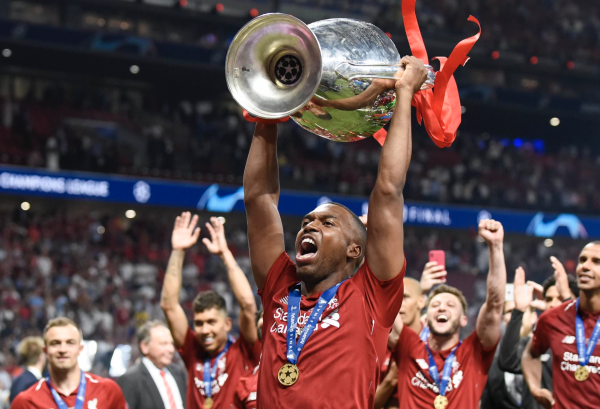 Daniel Sturridge raises trophy after championship win with Liverpool in 2019